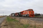 CN 3023 & 2940 roll east as they head down to the crossing of the NS Chicago Line