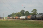 Southbound Kansas City Southern Railway Mixed Freight Train passes Yard Switchers