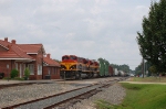 Southbound Kansas City Southern Railway Mixed Freight Train passes the former KCS Passenger Depot