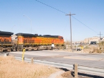 BNSF 4017 leads empty grain hoppers WB (north) at 9:18am