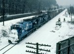 CR 5005 leads TV300 past the 39 signal during an early spring snow storm