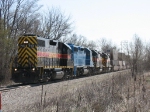 IAIS 713, 154, 706 & 702 leading a train of mostly double stacks westward into town