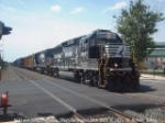 NS 4637 (uniquely carrying Operation Lifesaver livery) and NS 3545 mead into the station from the west, before stopping and reversing fnto a yard.