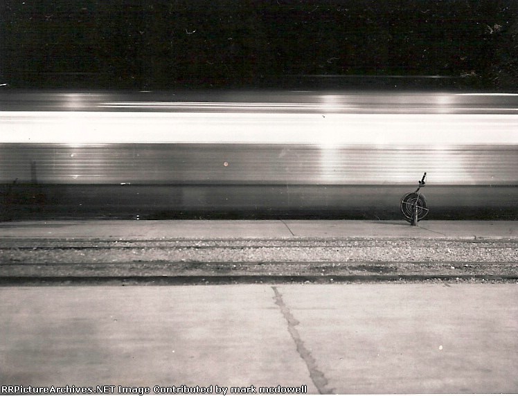 Hose bib watches Golden State arrive, 1955