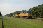 A pair of Union Pacific Railroad EMD SD70M Diesel Locomotives lead a Northbound CSX Transportation Empty Container Train