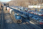 Southbound CSX Transportation Mixed Freight Train, with a pair of EMD SD40-2's providing power, passes the Metro-North Railroad Station