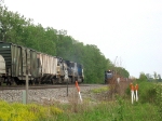 NS 6800 heads east past the 8310 who is still waiting to go west