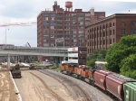 080719020 Westbound BNSF freight on Wayzata Sub passes new Stadium construction site