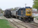 2645 shoves the outbound cars down the main as Y121 switches the Hamilton Farm Bureau