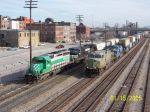 CSX train 579 on left racing NS train 21k led by new primer unit