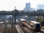 091013174 Eastbound Northstar MNRX commuter train meets a westbound counterpart at BNSF Northtown Yard