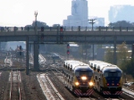 091013177 Eastbound Northstar MNRX commuter train meets a westbound counterpart at BNSF Northtown Yard