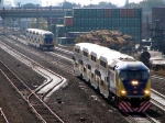 091013181 Eastbound Northstar MNRX commuter train meets a westbound counterpart at BNSF Northtown Yard