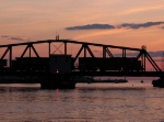 Just after sunset, two BNSF SD70MAC's lead N903-02 across the swing bridge