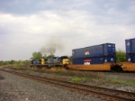 Two smokey C40-8's throttle up and head westbound 