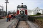 Santa's engineer and conductor on the left.