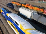 100914374 Westbound "Northstar" Commuter passes Schnabel CCRX 40010 At BNSF Northtown Yard 44th Ave