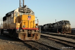 UP 2046 waits while NS 8981 has just crossed the Huey P. Long Bridge