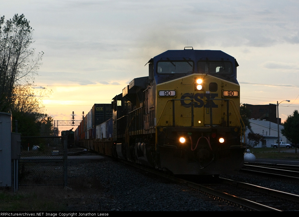 Q156 rolls east as the sun sets