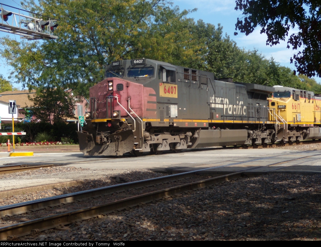 UP 6407 ex SP leads a empty coal 