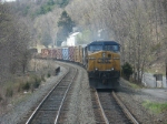 Q410 rolls northbound through CP-102 on a spring afternoon