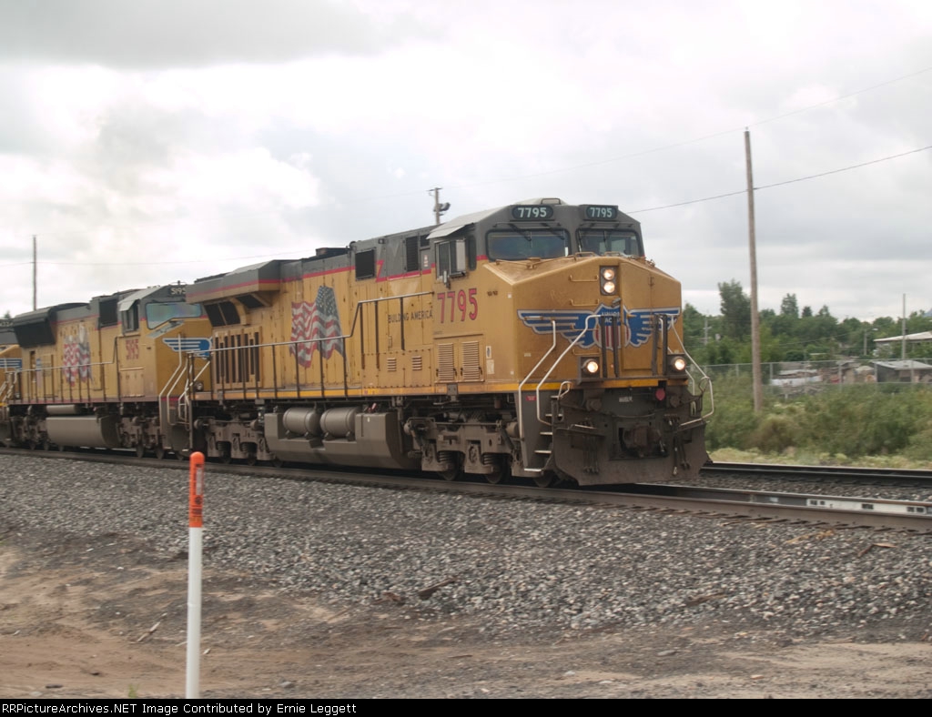 UP 7795 leads a WB doublestack at 09:41am 