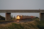 The CP's Train 199 Approaches Under a Setting Sun