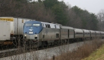 AMTK 150 leads Amtrak train 80, the Carolinian, past NS train 213