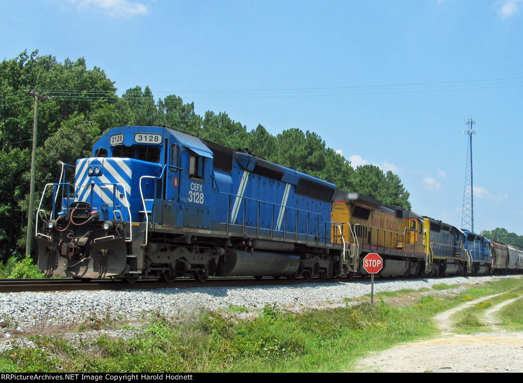 CEFX 3128 leads a colorful array of locomotives on a southbound train