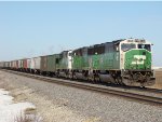 Rare units out of storage BN SD60M 8184 on the point of a EB grain train just outside Rochelle Ill. 3.11