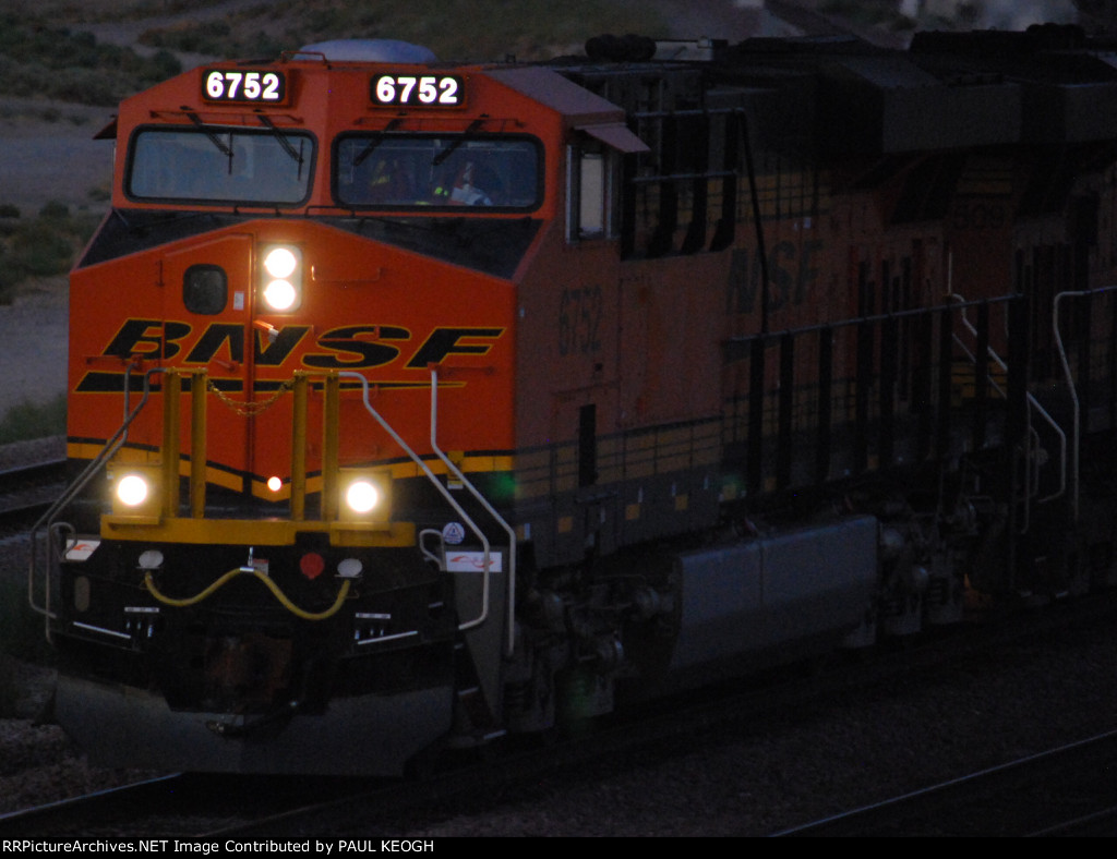 Zoom in shot  of BNSF 6752 as she rolls west leading a Z Train towards LA.