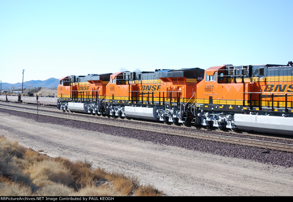 BNSF 6888, BNSF 6885, and BNSF 6887 roll past me as they continue west with the S LPC-LAC.