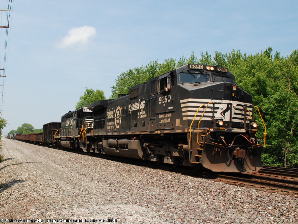 An Operation Lifesaver locomotive leads a mixed freight east.