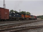 Q334 heads away toward Plaster Creek led by one unit each from HLCX, BNSF, IC&E, CP & CSX