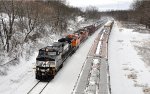 NS 64D eastbound with two BNSF engines on train.