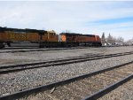 BNSF ES44AC 5980 and SD70MAC 8917 move a freight past the station area 