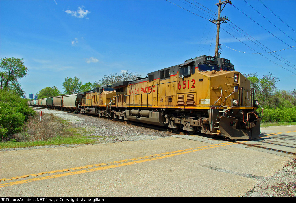 UP 6512 Leads a grain train.