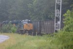 loaded coal holds the main while the ns train runs through the siding