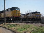 Union Pacific SD 60M stands watch at the Union Pacific Salina, Kansas yard while Union Pacific 7352 and 6840 face west