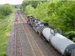 An ex-BC Rail unit is second out on westbound freight