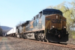 A small (8 car) Q156 rolls south at the crossing at MP 41