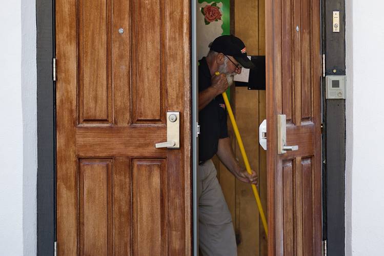 A member of a cleaning crew mops a floor inside the Emanuel AME Church where nine people at the historic black church were killed Wednesday. 