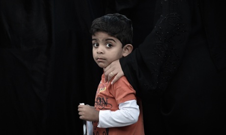 A Bahraini Shia boy takes part to a demonstration in solidarity with political prisoners in the village of Malikiya, south of Manama. Bahrain has announced a date for the trial of the thirteen Shia opposition leaders jailed for their role in last year's unrest.