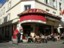 Photo of Tantek standing in front of Cafe des 2 Moulins