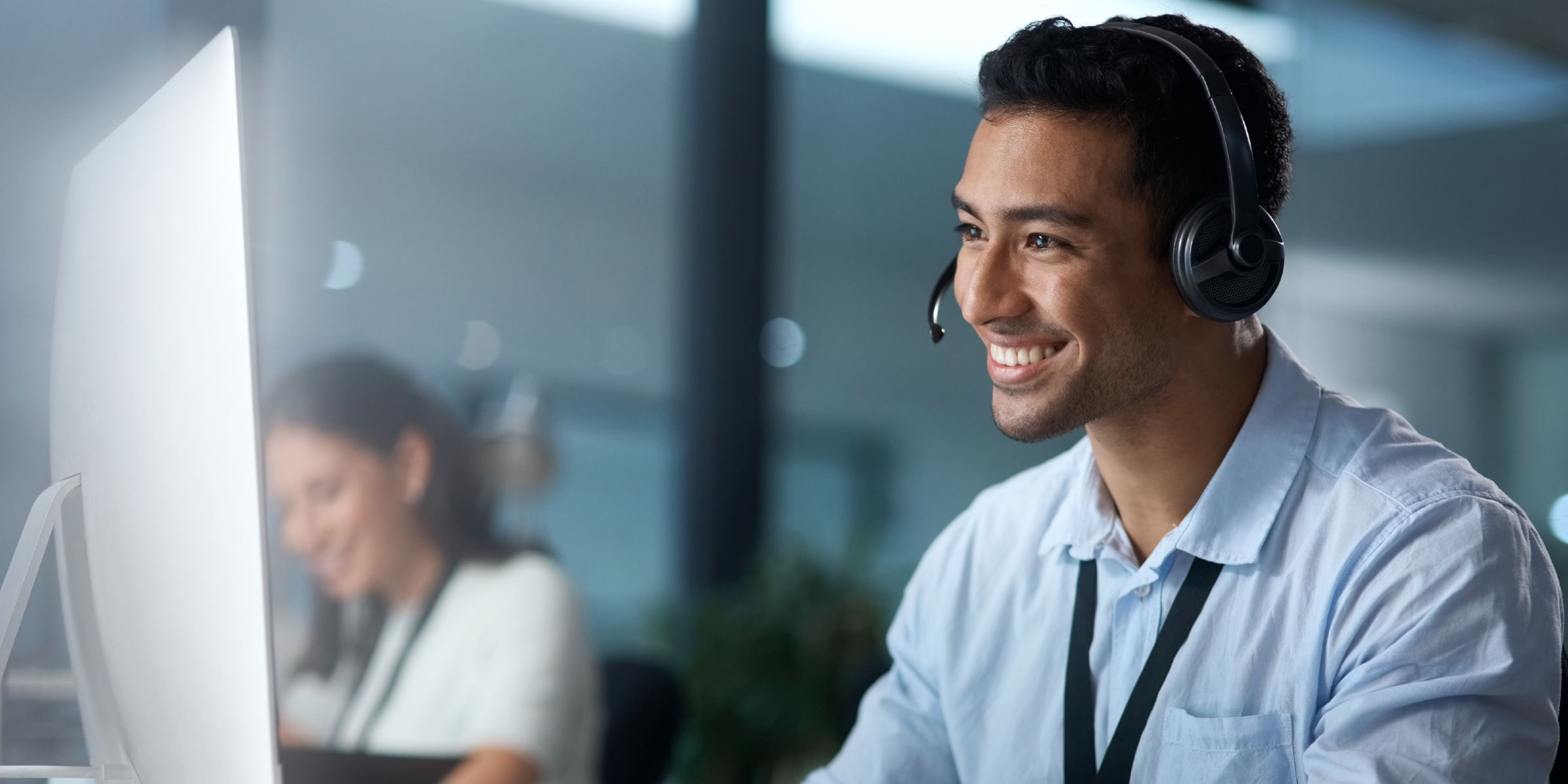 Man with headset smiling