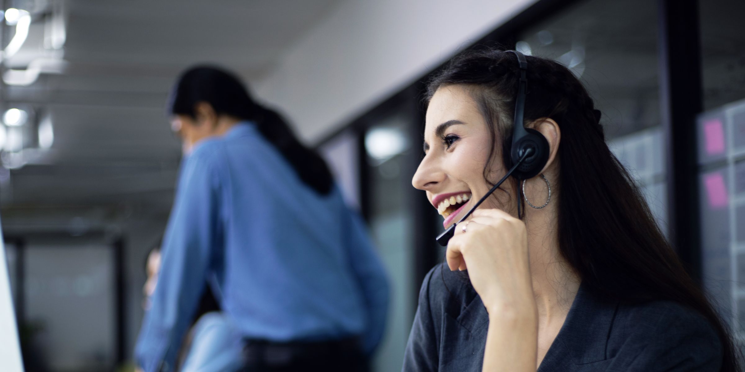 Woman with headset smiling