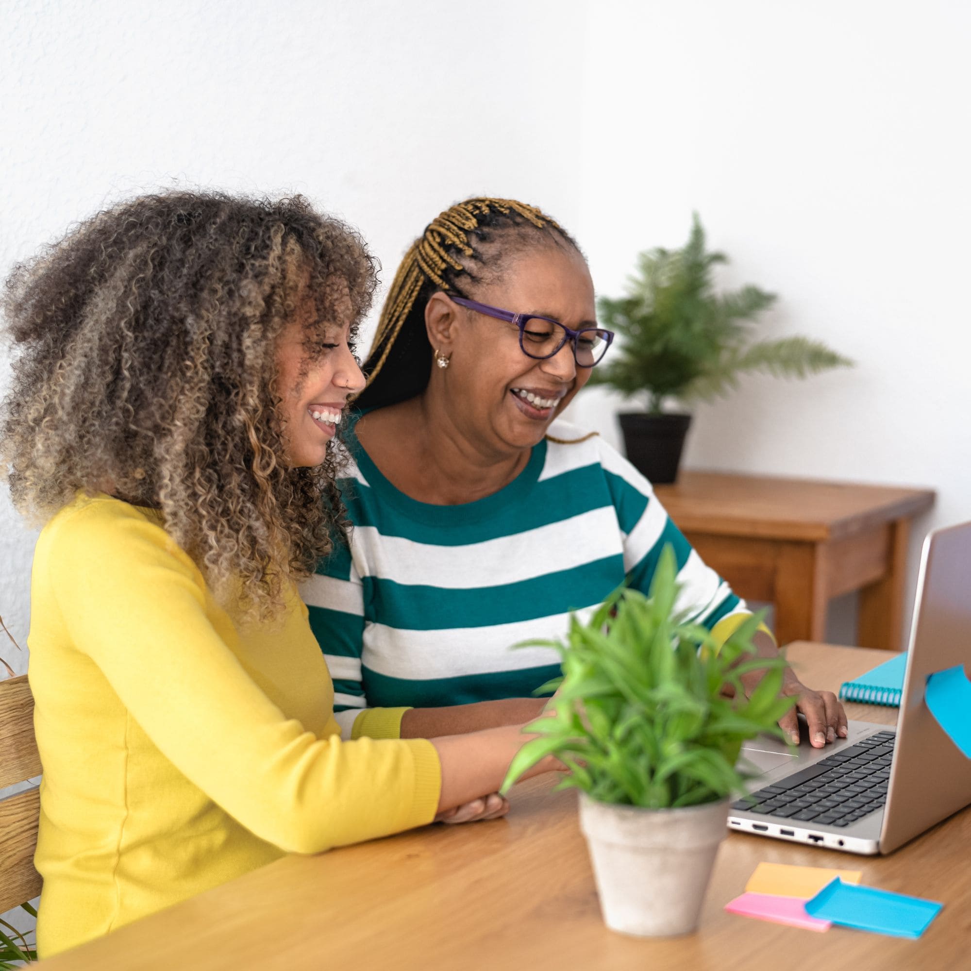 Two woman looking at laptop computer