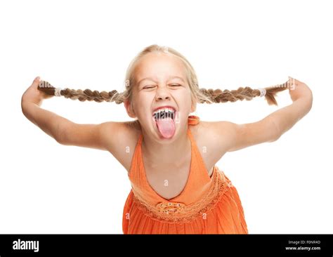 Little girl making funny face Stock Photo - Alamy