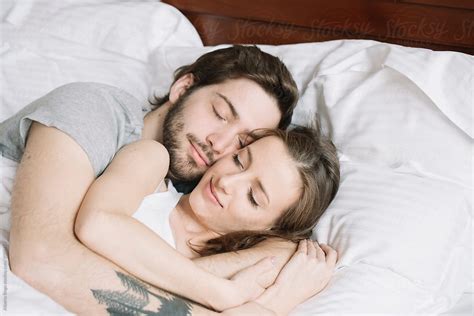 "Couple Sleeping Hugging On Pillow" by Stocksy Contributor "Studio ...