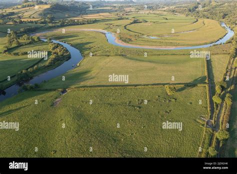 Aerial view of river meander with eroding earth banks, River Towy ...